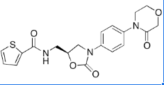 Rivaroxaban Impurity E ;Rivaroxaban EP Impurity E;Rivaroxaban Deschloro Impurity;N-[[(5S)-2-Oxo-3-[4-(3-oxo-4-morpholinyl)phenyl]-5-oxazolidinyl] methyl]-2-thiophenecarboxamide;  | 1415566-28-7